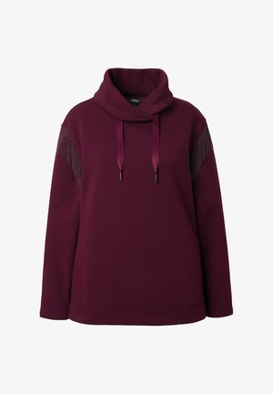 Burgundský pulovr s přehozem a stahovací šňůrkou. Má kovové akcenty na ramenou a dlouhých rukávech. Měkká textura materiálu.