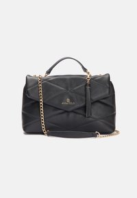 Black quilted handbag with gold hardware, featuring a detachable chain strap, tassel detail, and a flap closure. Smooth leather texture.