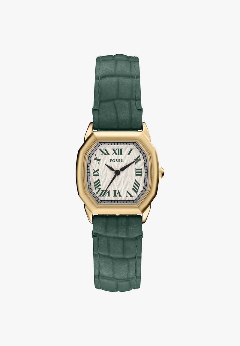 Gold-tone square watch with green Roman numerals, white textured dial, and green leather strap with crocodile pattern.