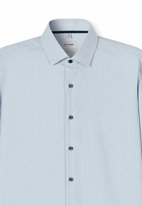 Light blue button-up shirt featuring a textured pattern, classic collar, and dark blue buttons. Fabric offers a smooth, breathable finish.
