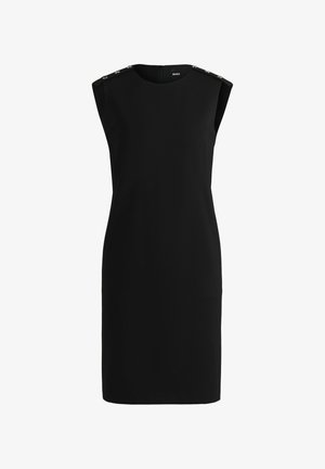 Robe noire sans manches avec un col rond, ornée de boutons décoratifs à l'épaule et d'une fermeture éclair dans le dos. Tissu lisse.