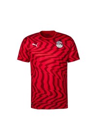 Röd Puma sporttröja med mörkröda abstrakta zigzag-mönster, Egyptens nationella fotbollsförbunds logotyp på bröstet och Puma-logotypen på högra sidan.