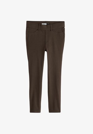 Brune slim-fit jerseyleggings med forlommer og bæltestropper, vist mod en hvid baggrund.