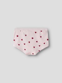 Hele helehallidel taustal heleroosa naistepesu, millel on hajusalt väikesed punased südamekujulised mustrid.