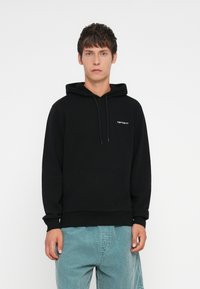 Black hoodie with drawstring, kangaroo pocket, ribbed cuffs, and hem. Features a small white logo on the left chest. Soft cotton blend fabric.