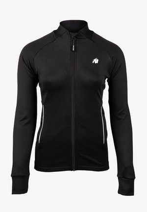 Zwarte sportjack met lange mouwen, volledige rits, witte accenten aan de zijkanten en een verhoogde kraag. Gemaakt van gladde, rekbare stof.