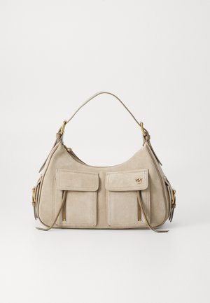 Beige suede shoulder bag with two front flap pockets, gold zipper details, leather pulls, and a single strap with gold hardware fittings.