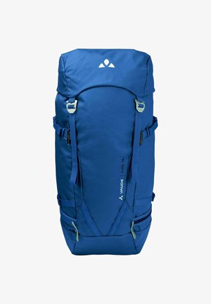 Zaino da escursionismo blu con una forma strutturata, spallacci regolabili e numerosi tasche esterne. Presenta dettagli in zip verde chiaro.