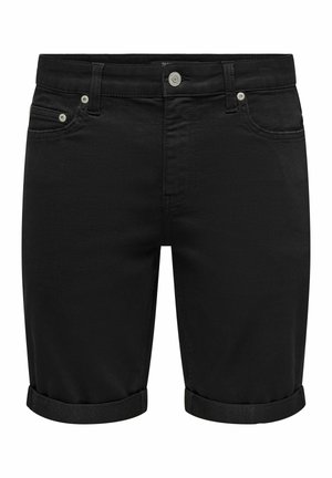 Crne traper šorts hlače s uskim krojem, završetkom na prevrnute rubove i pet džepova. Sadrže metalnu opremu i glatku teksturu.