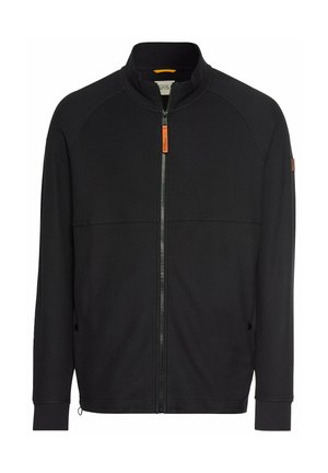 Zwarte dichtritsjas met hoge kraag, gestructureerde stof, contrasterende oranje ritssluiting, en zijzakken. Voorzien van raglanmouwen.