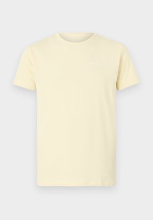 Jasnożółta bawełniana koszulka z krótkim rękawem i okrągłym dekoltem; ma małe białe logo na górnej lewej części klatki piersiowej.