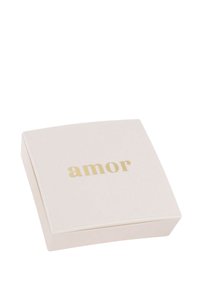 Contenitore quadrato beige con angoli arrotondati, con la parola "amor" in lettere dorate sulla parte superiore, finitura opaca liscia.