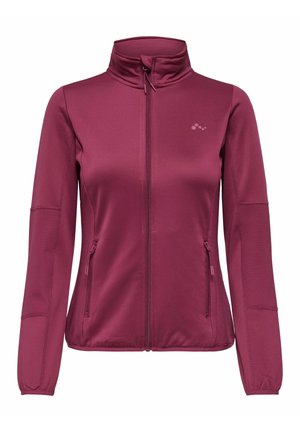 Veste zippée pour femme de couleur rose foncé avec col montant, deux poches latérales zippées et texture côtelée sur les manches et les côtés.
