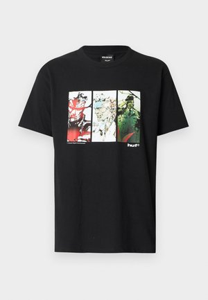 Black short-sleeve T-shirt with three colored comic-style character panels on front, featuring red, white, and green tones and "huf" logo.