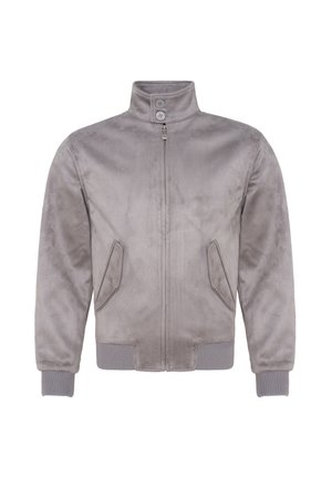 Veste en tissu doux gris avec col montant, fermeture éclair, deux boutons au niveau du cou, poches latérales inclinées et poignets et ourlet côtelés.