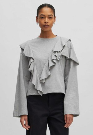 Grijze long-sleeve top met een rimpelontwerp aan de voorkant. Gemaakt van een zachte stof met een relaxte pasvorm en een cropped lengte. Heeft brede mouwen.