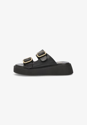 Sandalias de plataforma de cuero negro con dos hebillas ajustables. Presenta una suela de goma texturizada y un diseño de suela gruesa.