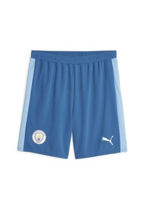 Niebieskie spodenki sportowe z jasno-niebieskimi paskami po bokach, herbem Manchester City na lewej nogawce oraz białym logo Puma na prawej nogawce.