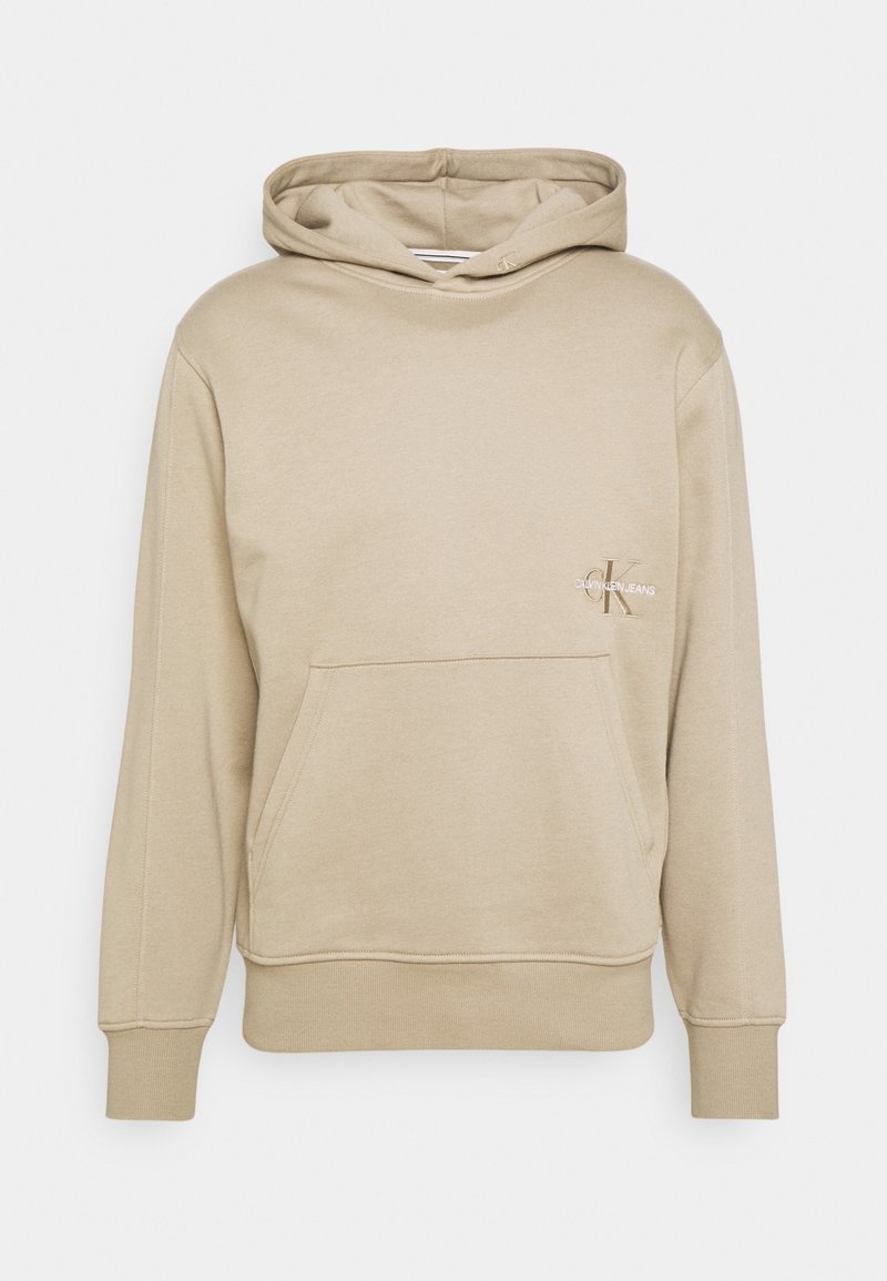 Sweat à capuche beige avec poche avant et logo Calvin Klein Jeans sur la poitrine gauche, avec poignets et ourlet côtelés.