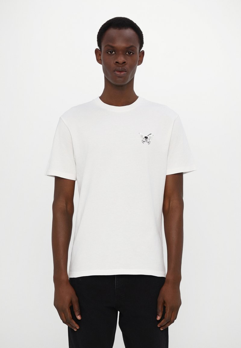 White cotton t-shirt with a crew neck and short sleeves. Features a black graphic of a butterfly and skull on the left chest.