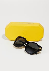 Swarovski Saulesbrilles - black