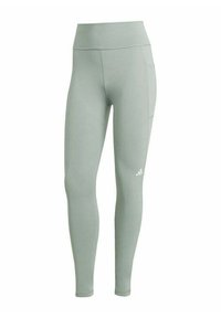 Lichtgroene leggings van rekbaar materiaal, met een hoge tailleband en een zijzak. Minimalistische branding met een klein logo-detail.