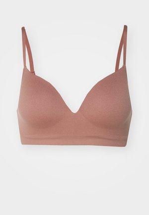 Bezszwowy, miękki biustonosz w stonowanym kolorze różowym z regulowanymi ramiączkami i dekoltem w serek. Bez poduszek dla większego komfortu.