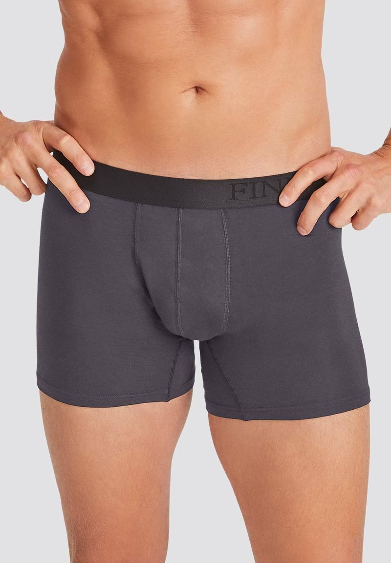 Gray men's boxer briefs with a black elastic waistband, featuring a front pouch and smooth fabric texture. Designed for comfort and fit.