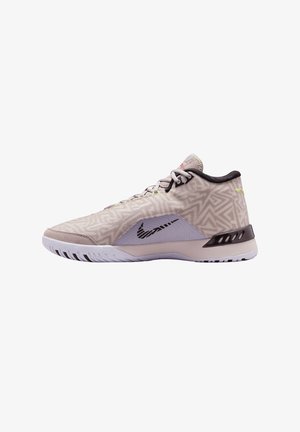 Basket sneaker beige basse avec des motifs géométriques, logo Nike noir, doublure intérieure noire et semelle texturée blanche.