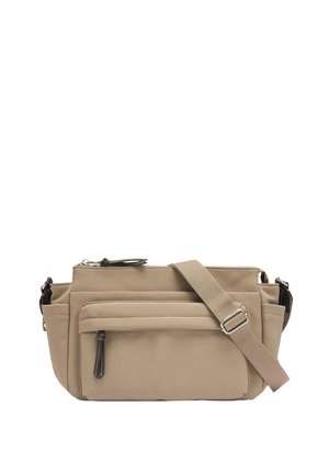 Beżowa torebka na ramię z wieloma kieszeniami zapinanymi na zamek i regulowanym paskiem. Wykonana z miękkiego materiału o gładkiej fakturze i minimalnej ilości elementów metalowych.