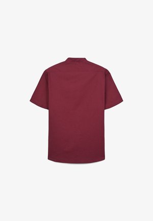 Maglietta a maniche corte color mogano con collo piatto, orlo dritto e texture liscia. Vista posteriore senza motivi o elementi visibili.