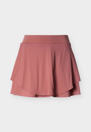 Falda pantalón deportiva rosa con capas, cinturilla ancha, tejido de punto elástico y dobladillo acampanado sobre un fondo blanco.