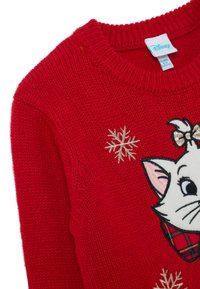 Maglioncino rosso a maglia, caratterizzato da un gatto bianco con un colletto a quadri, decorato con fiocchi di neve dorati e un collo rotondo. Etichetta Disney inclusa.