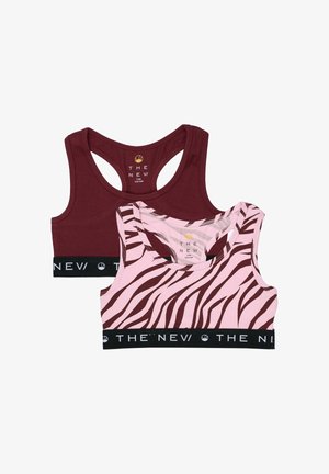Deux soutiens-gorge de sport pour filles, l'un rouge foncé uni et l'autre rose avec des rayures zébrées marron, tous deux avec des bandes élastiques noires portant la mention "THE NEV".