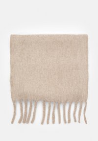 Beige ullscarf med en mjuk, texturerad yta. Har långa, knutna fransar längs nederkanten. Rektangulär form.