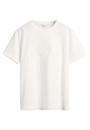 T-shirt blanc à manches courtes GANT avec logo et blason embossés à l’avant, col rond, présenté sur fond blanc.