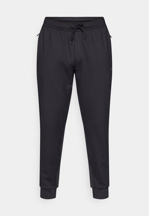 Black jogger pants made of smooth fabric, featuring an elastic waistband with a drawstring, side pockets, and tapered legs.