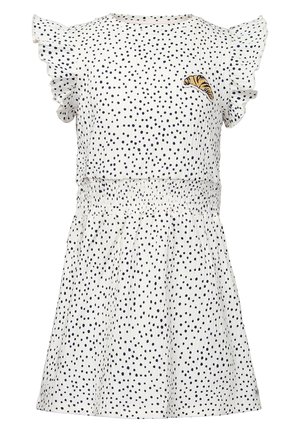 Vestido blanco con lunares negros, mangas cortas con volantes, cintura elástica y un pequeño parche de croissant en el pecho.