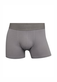 Boxers grises de tejido suave, con una amplia cinturilla elástica estampada con "Resteröds". Diseñados con un soporte en la parte delantera.
