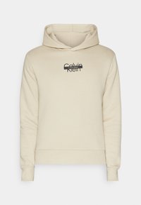 Felpa con cappuccio beige realizzata in tessuto morbido, caratterizzata da un logo Calvin Klein nero sul petto. I polsini e l'orlo a coste offrono struttura.