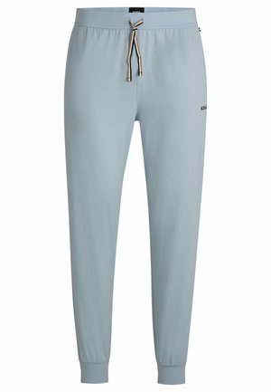 Pantalons de survêtement bleus en tissu léger, dotés d'une taille élastique avec cordon de serrage et de manchettes côtelées. Petit logo sur le côté.