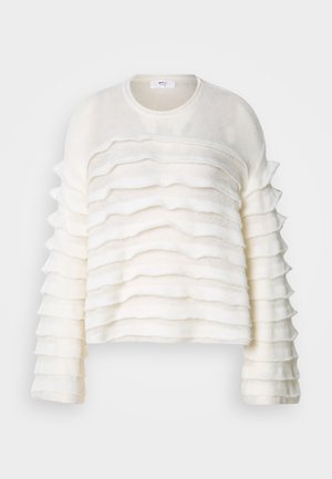 Hvit, teksturert genser med lagdelte volanger langs kroppen og ermene. Rund halslinje og cropped design. Mykt stoff og løs passform.