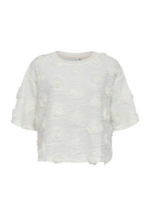 Haut blanc à manches courtes texturé avec des applications florales en 3D et un col rond.