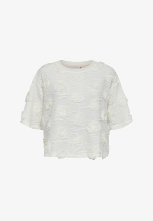 Haut blanc à manches courtes texturé avec des applications florales en 3D et un col rond.