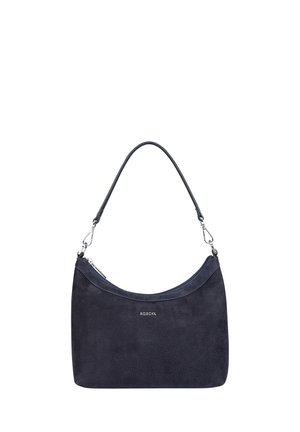 Navy suede handbag with curved top, single shoulder strap, and silver hardware accents. Features embossed logo. Smooth texture, rectangular shape.