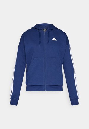 Navy zip-up hoodie made of soft fabric, featuring a front pocket, white stripes along sleeves, and a logo on the chest.