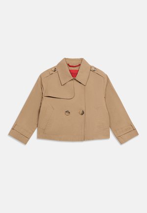 Beige cropped jacket with double-breasted buttons, wide collar, shoulder epaulets, and two front pockets, laid flat on a white background.