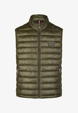 Olive green padded vest with high collar, front zipper, and side pockets. Features a logo patch on the chest and textured quilting.