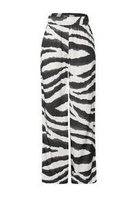 Pantalons à motifs zèbre noir et blanc avec une coupe ample, ceinture élastique et texture lisse, présentant des rayures audacieuses alternées.