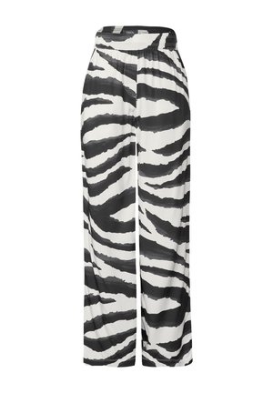 Spodnie w zebrzysty wzór w odcieniach czerni i bieli, o luźnym kroju, elastycznym pasku w talii i gładkiej teksturze, z wyrazistymi, naprzemiennie układającymi się paskami.